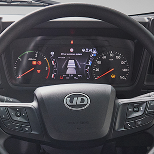Truck steering wheel and dashboard with warning lights and digital display.